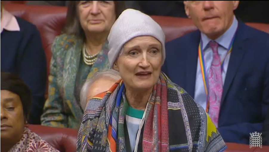 Tessa Jowell wearing a wool hat and brightly coloured scarf