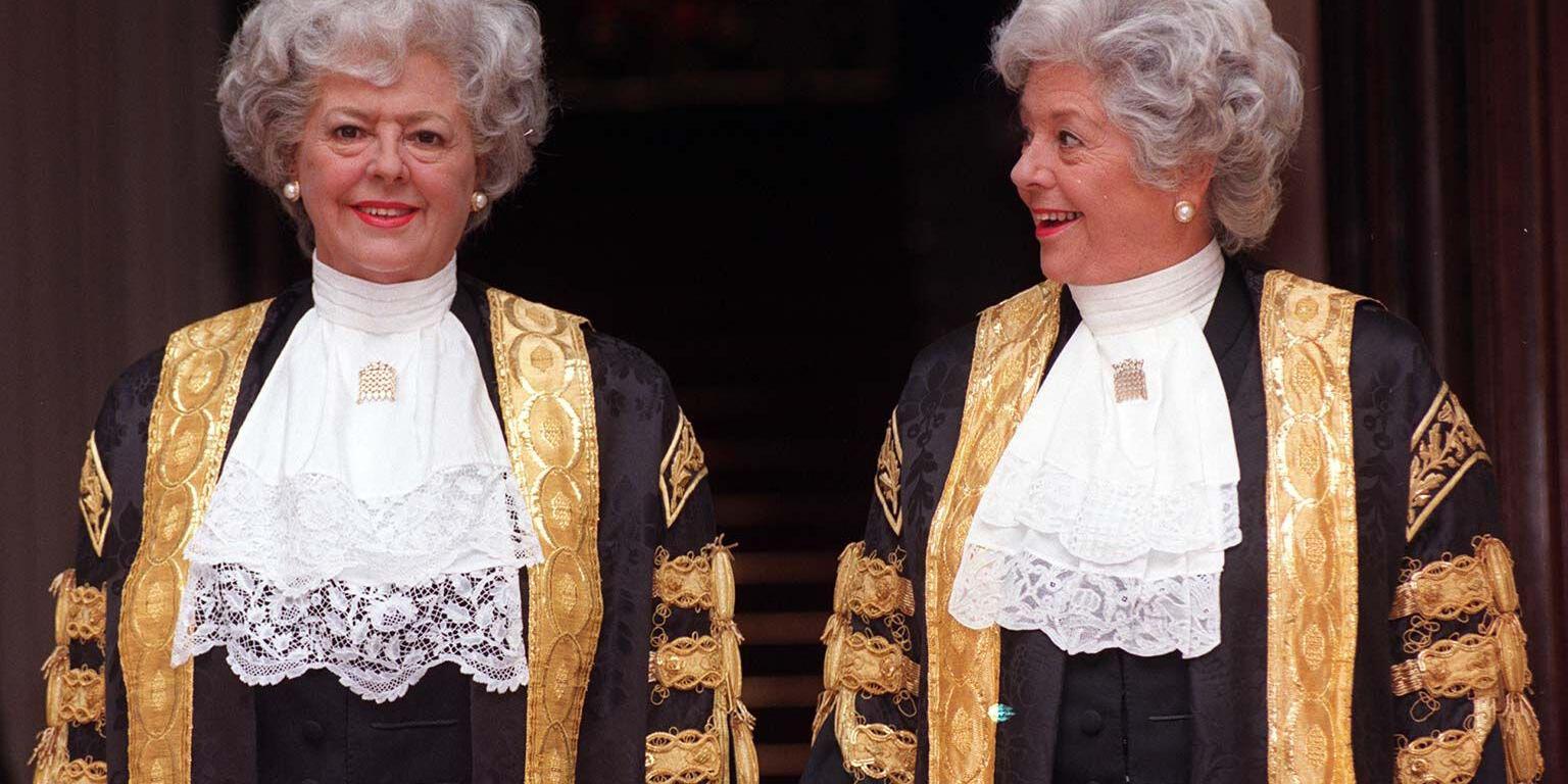 Colour photo showing Boothroyd in her Speaker's robes looking sideways at her waxwork dressed in identical clothes